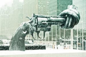 Disarmament Sculpture (Twisted Revolver) covered in ice and snow, outside the visitors entrance to the United Nations Building in New York City.