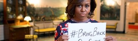 First Lady Michelle Obama holding a sign with the hashtag "#bringbackourgirls" in support of the 2014 Chibok kidnapping. Posted to the FLOTUS Twitter account on May 7, 2014. Source: Wikipedia