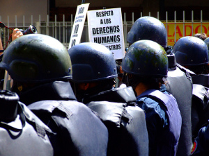 Riot police line up at a student protest in Caracas Source: Rodrigo Suarez, Flickr