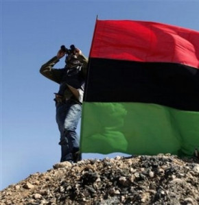 Anti-Gaddafi rebel looks to the sky in the oil town of Ras Lanouf, eastern Libya, Sunday, March 6, 2011. Source: Cropped version of BRQ Network image (via Flickr)