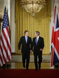 U.S. President George W. Bush and British Prime Minister Tony Blair at the White House, July 2003. Source: White House (via Wikipedia)