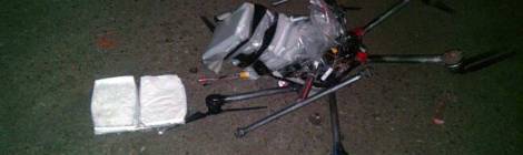 In this image released by the Tijuana Municipal Police on Wednesday Jan. 21, 2015, a drone loaded with packages containing methamphetamine lies on the ground after it crashed into a supermarket parking lot in the city of Tijuana on Tuesday Jan. 20, 2015. According to police, six packets of the drug, weighing more than six pounds, were taped to the six-propeller remote-controlled aircraft. Authorities are investigating where the flight originated and who was controlling it. He said it was not the first time they had seen drones used for smuggling drugs across the border. Other innovative efforts have included catapults, ultralight aircraft and tunnels. (AP Photo/Secretaria de Seguridad Pública Municipal de Tijuana)