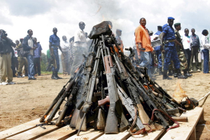Weapons being burnt during the official launch of the Disarmament, Demobilization, Rehabilitation and Reintegration (DDRR) process in Muramvya, Burundi. Burundian military signed up voluntarily to be disarmed under the auspices of United Nations peacekeepers and observers. 2/Dec/2004. Muramvya, Burundi. UN Photo/Martine Perret. www.un.org/av/photo/