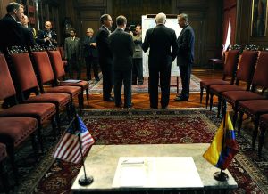 Colombian Defense Minister Gabriel Silva, U.S. Defense Secretary Robert M. Gates, center right, and U.S. Ambassador to Colombia William R. Brownfield talk to one another at the Presidential Palace before meetiing with President Alvaro Uribe in Bogota, April 15, 2010.
