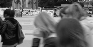 Young people walk past an anti-nuclear weapons protest outside the NPT Review Conference, Geneva, 2008 Source: BANG (Flickr)